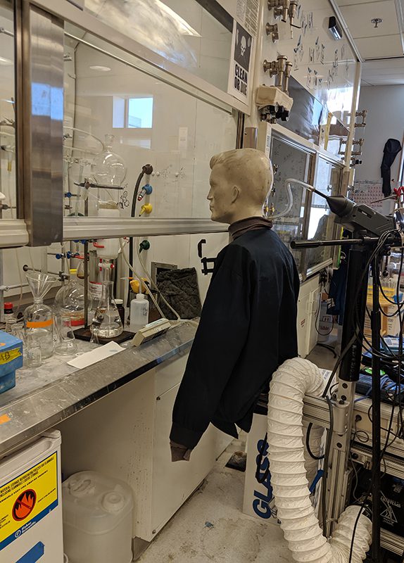 Mannequin at a fume hood during an airflow test.